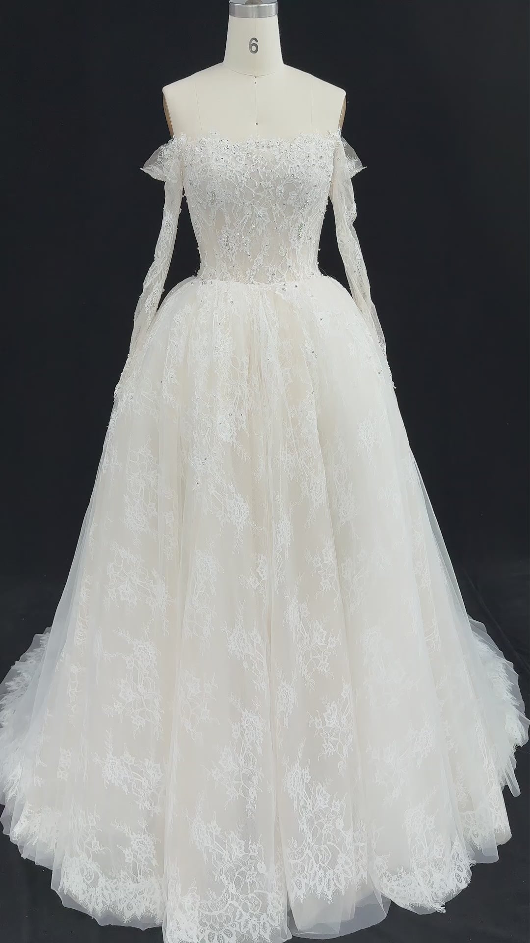 Load video: White Lace Ball Gown Wedding Dress Off the Shoulder with Long Sleeves and Beaded Details SW679