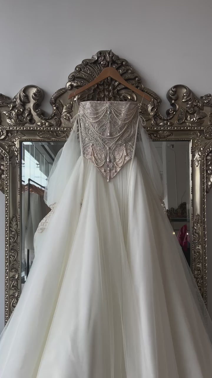Load video: White Pearl Beaded Corset Wedding Dress with Detachable Puff Sleeves SW663