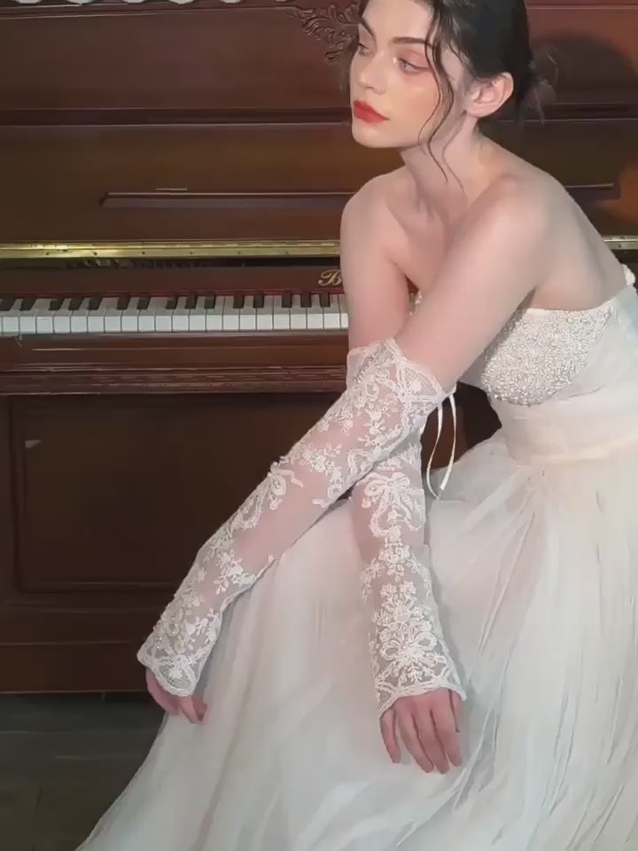 Load video: Chic Pearl Beaded Lace Fingerless Sleeves Long Wedding Bridal Gloves for Women GL005