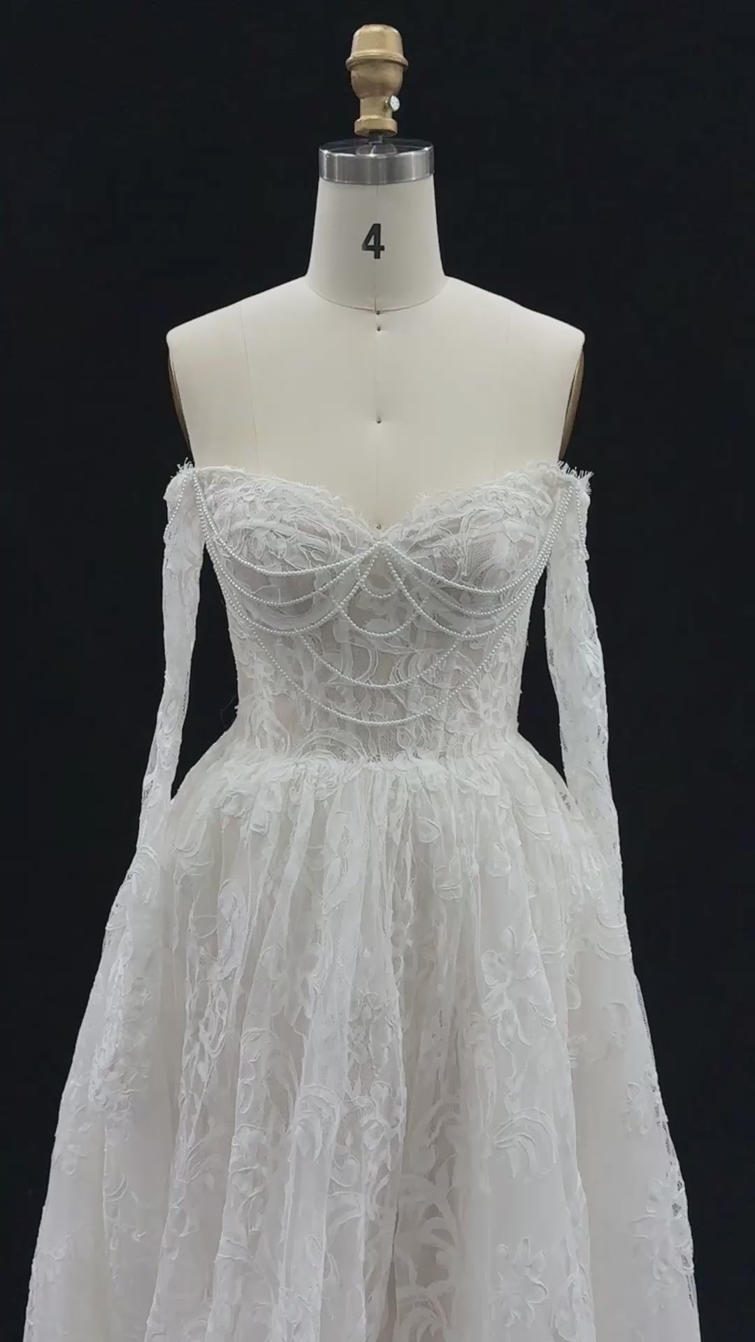 Load video: White Off Shoulder Lace Long Sleeve Wedding Gown